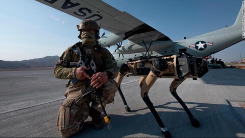 Image of Air force solider next to plane and robot dog