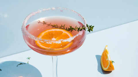 Cocktail with orange slices below