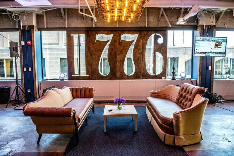 Two comfortable couches in front of 1776 cutout on wall