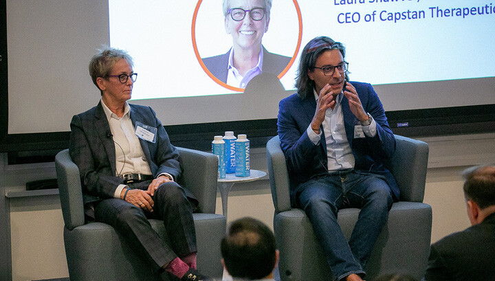 Image of two panelists speaking to crowd