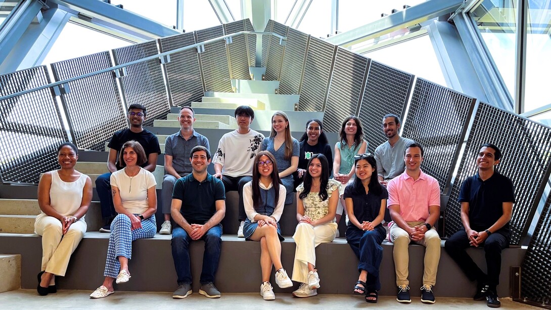 Accelerator cohort sitting on small pitch bleachers in Pennovation Center