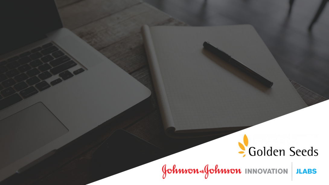 black and white photo of a laptop and an open notebook with a pen, accompanied by the golden seeds and JLABS logos
