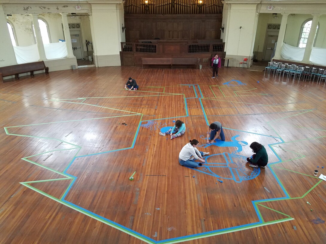 students creating a tape mural