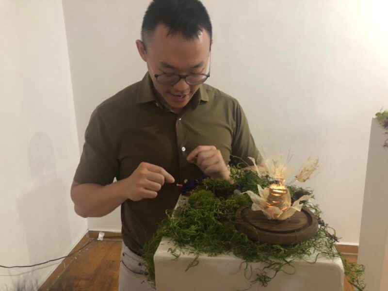 Robot sculpture and its creator 