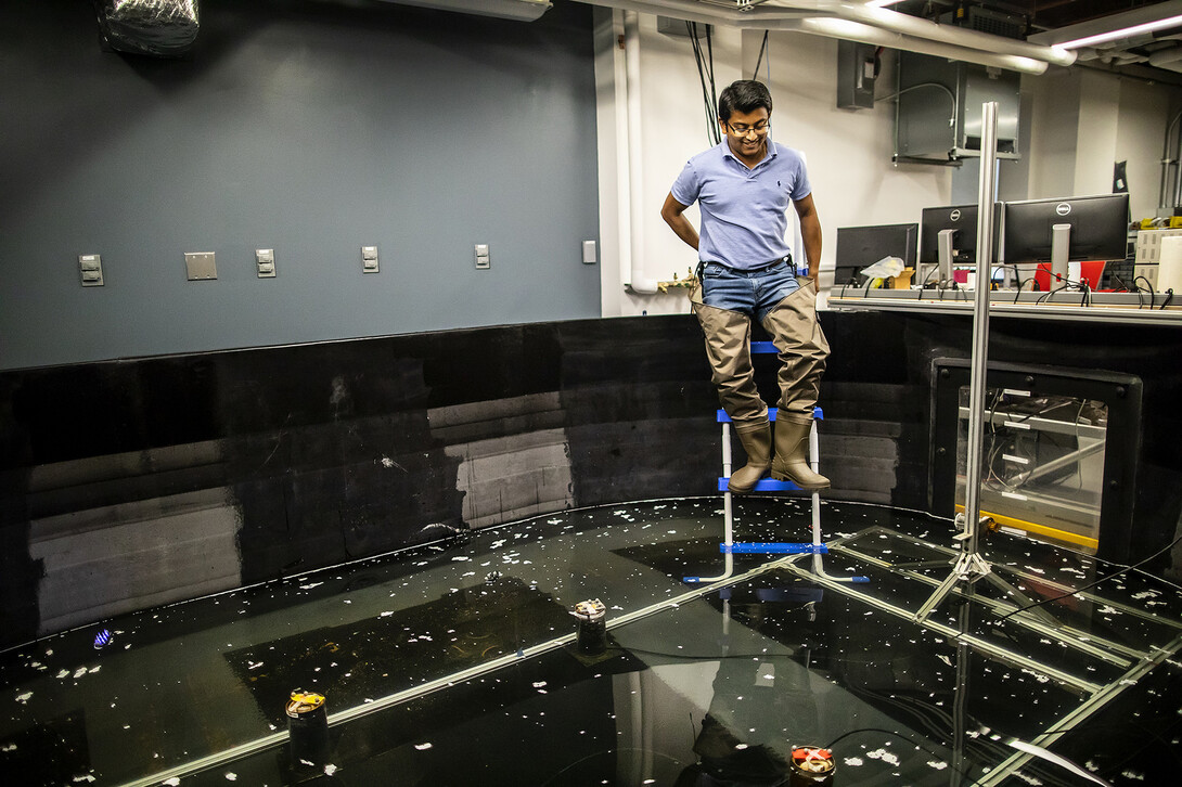 Penn Engineer testing an ocean simulating indoor pool